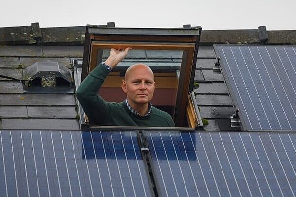 Max inspecting some solar panels